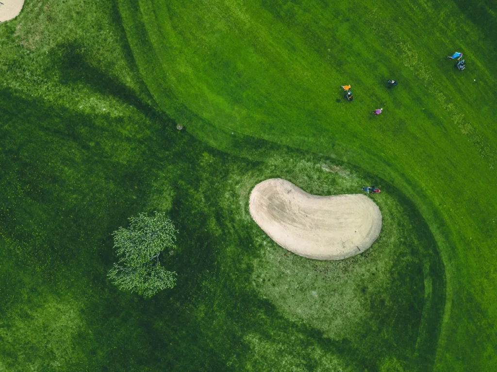 Aerial view of green grass at golf course in Finland